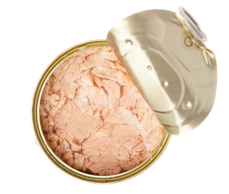 open tuna tin on a white background